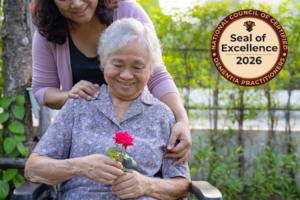 An elderly woman and her caregiver