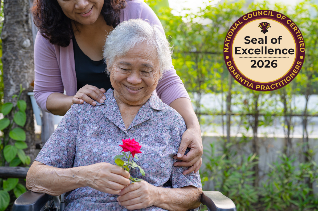 An elderly woman and her caregiver