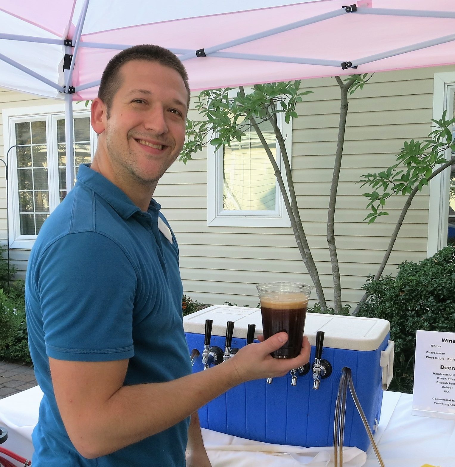 brewer holding home brew beer