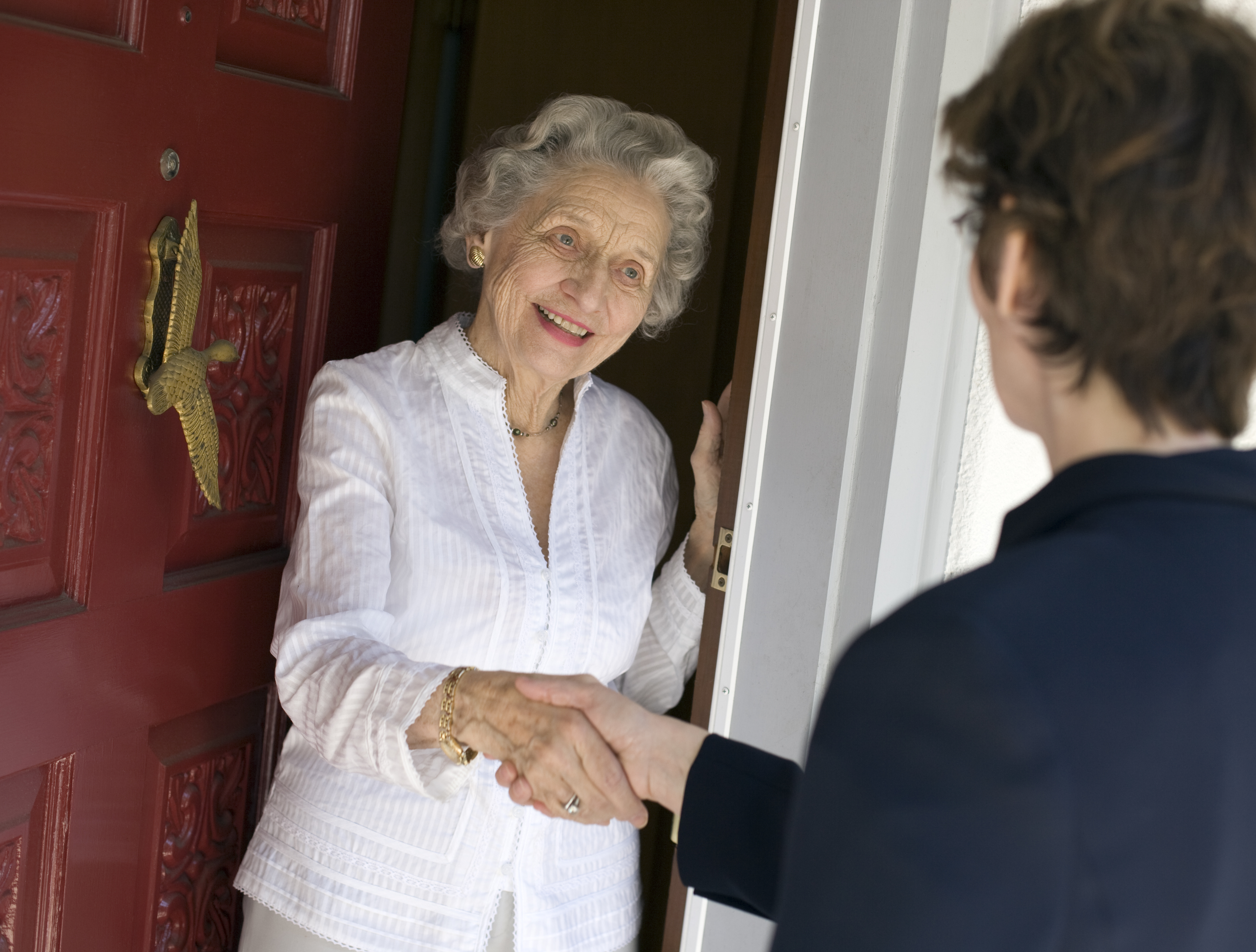 senior answering door