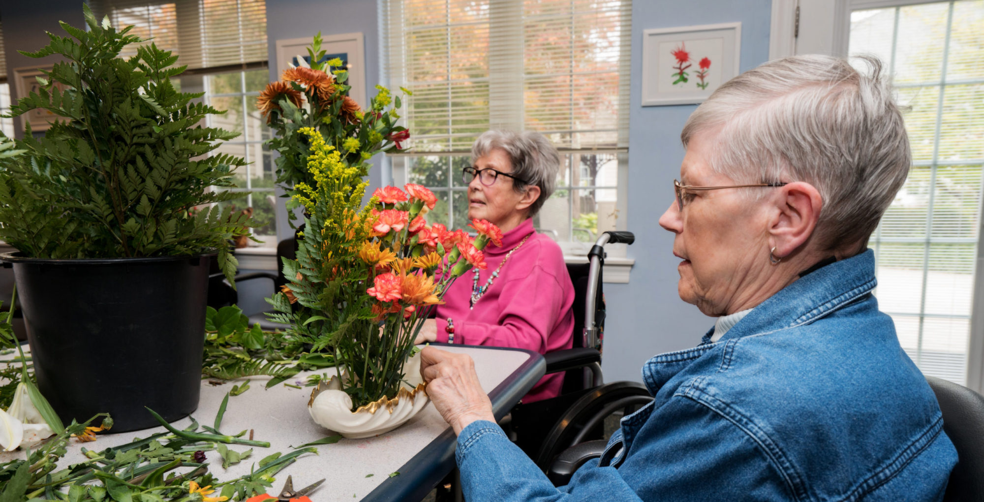 Residents Arrange Flowers with Volunteers