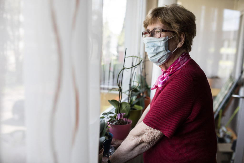 senior woman in mask during COVID