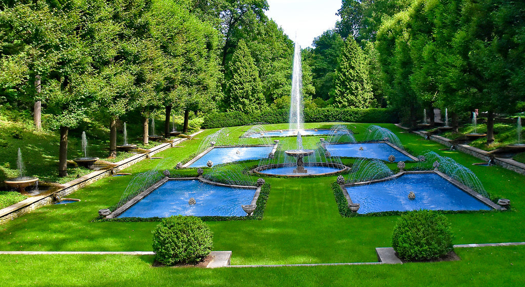 green grass with centered water fountains